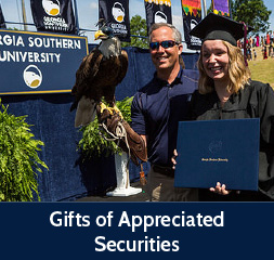 Rollover image of a graduate posing with an eagle. Link to Gifts of Appreciated Securities.